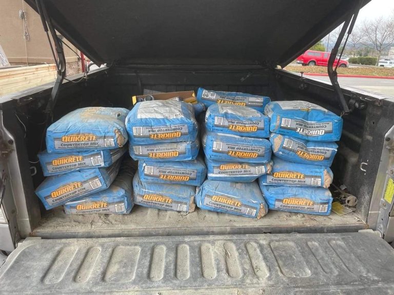 18 bags of concrete in the back of a pickup truck