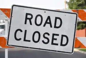 Photo of "Road Closed" sign on barricade