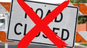 Construction "road closed" sign with red X superimposed