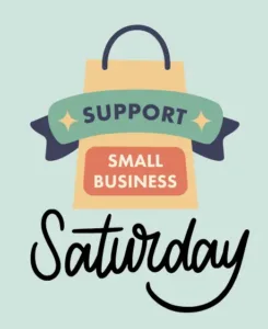 Orange, yellow and green sign starting "Support Small Business" with "Saturday" in black beneath